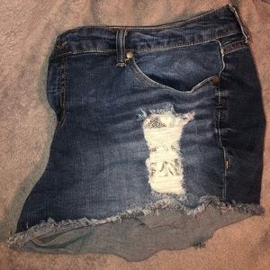 Torrid distressed denim shorts with white lace